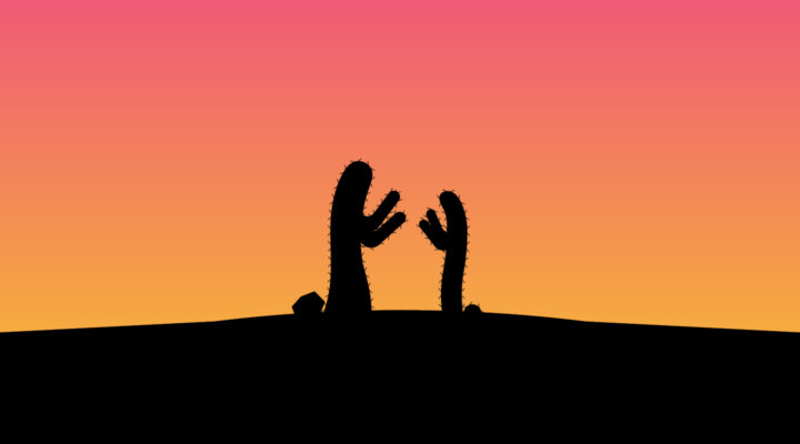 Two cacti in boxing position silhoutted against a pink and yellow sunset.